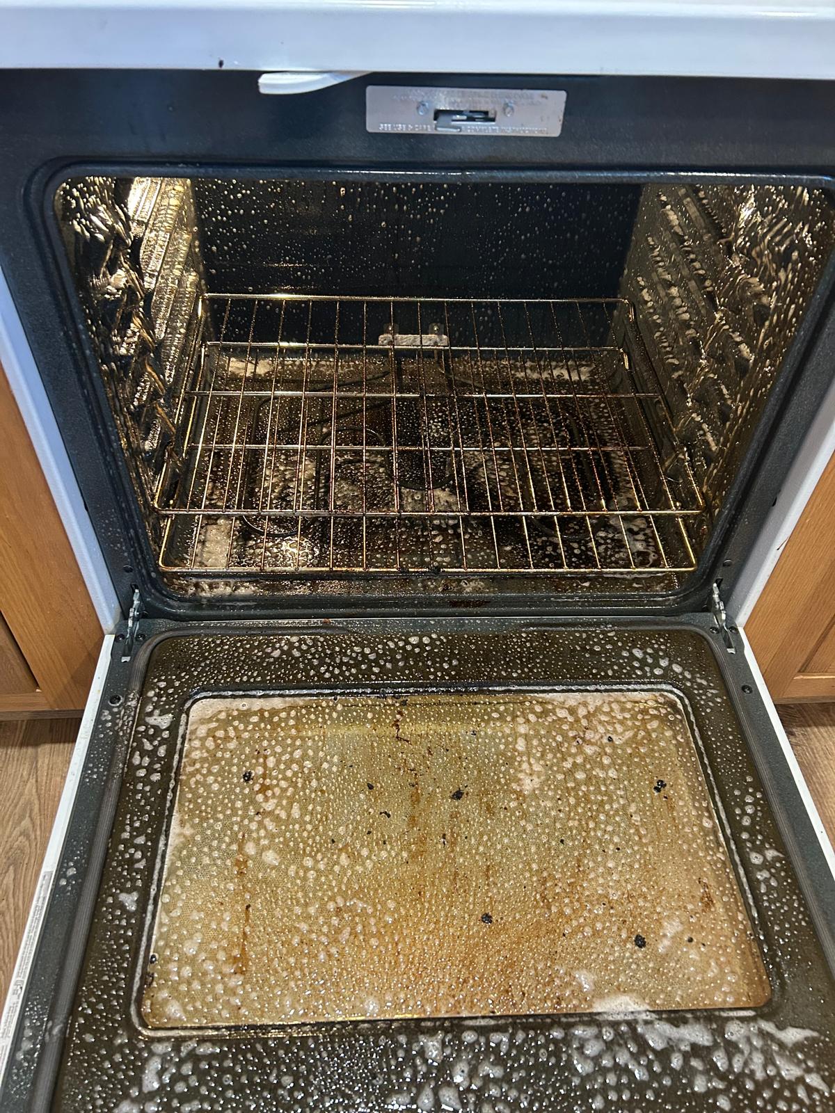 Greasy oven interior before deep cleaning by Nely Marvelous in the DMV