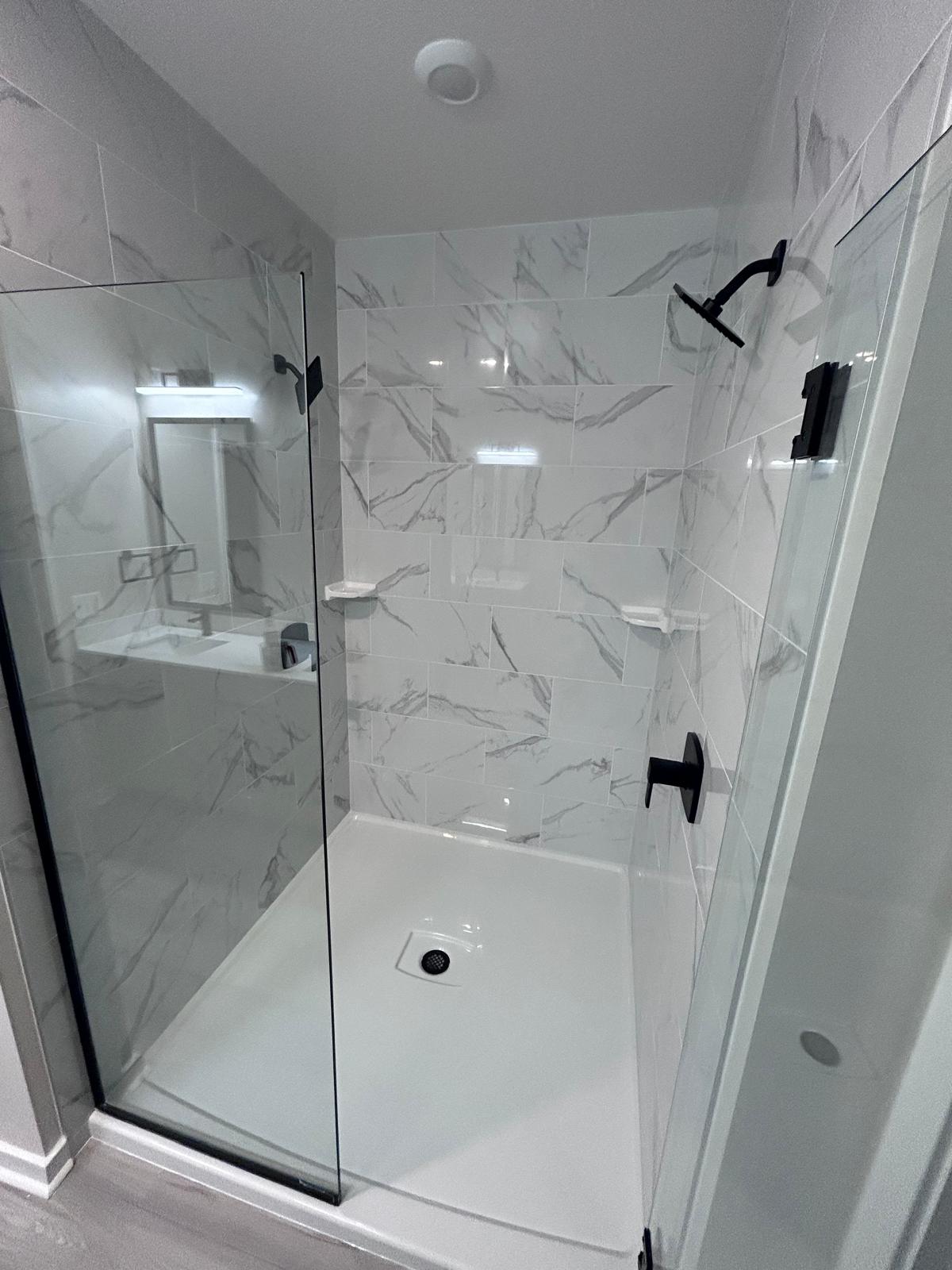 Marble tile walk-in shower cleaned and polished
